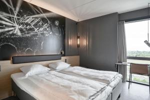 Four Points Flex by Sheraton Copenhagen Arena房間的床