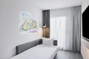 Posteľ alebo postele v izbe v ubytovaní Moxy Barcelona