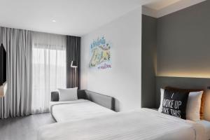 Posteľ alebo postele v izbe v ubytovaní Moxy Barcelona