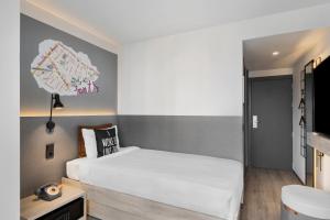 Posteľ alebo postele v izbe v ubytovaní Moxy Barcelona