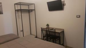 TV a/nebo společenská místnost v ubytování Hotel Antigone