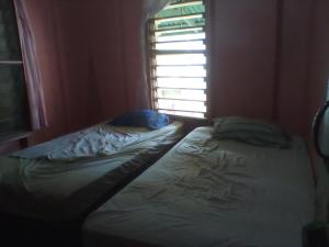 Un pat sau paturi într-o cameră la Hotel LomaVista