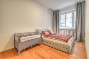 Postel nebo postele na pokoji v ubytování Apartmán se 2 ložnicemi