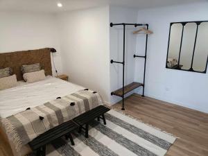 a bedroom with a large bed and a mirror at Our Place in Pico in Companhia de Cima +12 photos