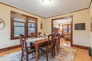 a dining room with a table and chairs at Charming Ann Arbor Retreat Near DT & Attractions home in Ann Arbor