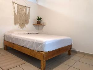 Postel nebo postele na pokoji v ubytování Casa Maya Xul-Ha