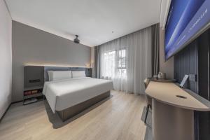 Gulta vai gultas numurā naktsmītnē Atour Light Hotel Chengdu Yulin Street Nijia Bridge