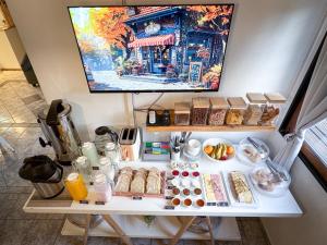 a white table with food on top of it at Hotel Alta Mendoza in Mendoza