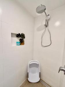 a bathroom with a toilet and a shower at Panda's Patch Dunsborough in Dunsborough