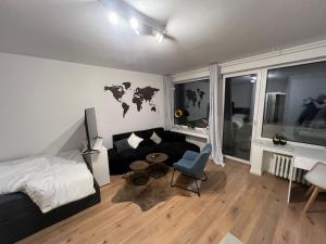 a bedroom with a bed and a desk and a chair at Cologne City Studioaparment in Cologne +5 photos