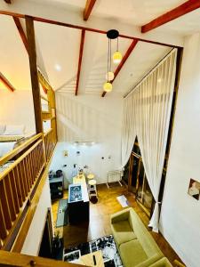 a living room with a couch and a table at Dieng Faeyza Homestay in Dieng
