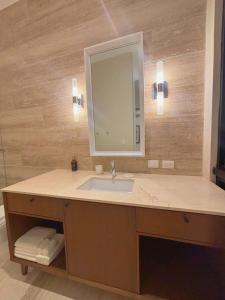 a bathroom with a sink and a mirror at Casa Continental Hotel Boutique & Suites - Adults Only in Mérida