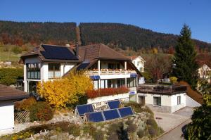 an aerial view of a house with solar panels on it at BnB Villa Moncalme in Travers