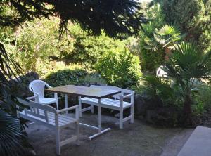a table and two chairs and a table and a table and chairs at Charming Rovinj Haven in Rovinj