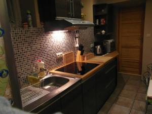 a kitchen with a sink and a counter top at Apartamenty Nad Zalewem in Nieporęt +31 photos