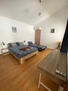 a living room with a bed and a couch at Holiday Villapark-Seaview Albena - Villa 1-2 in Rogachevo