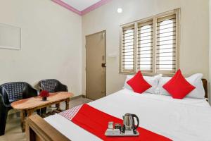 Ένα ή περισσότερα κρεβάτια σε δωμάτιο στο Hotel O Sri Banashankari Residency +19 φωτογραφίες