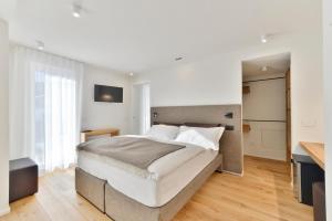 Postel nebo postele na pokoji v ubytování Hotel Zerbion