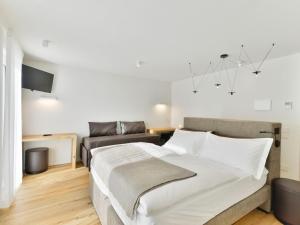 Postel nebo postele na pokoji v ubytování Hotel Zerbion