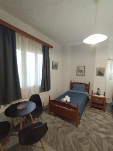 Postel nebo postele na pokoji v ubytování VALIA ROOMS