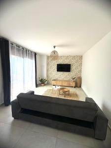 a bedroom with a large bed in a room at Le Sounta in Saint-Pierre