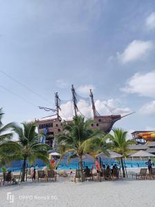 a pirate ship on a building on a beach at Sweet Escape at Splashmania in Banting