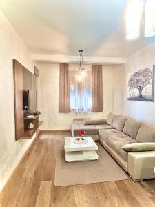 Un lugar para sentarse en Apartman AMIGO & Spa