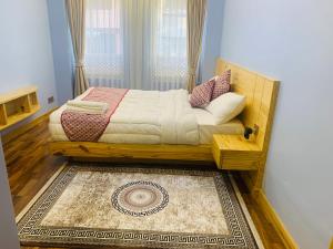 a bedroom with a bed and a rug at Chiba Heritage Home in Pātan