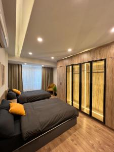 a bedroom with three beds in a room at Duplex 3Bedroom Apartment Overlooking Giza Zoo Perfect for Families and Friends in Cairo