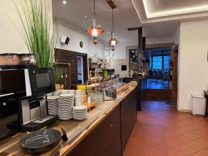 Kuchyň nebo kuchyňský kout v ubytování Hotel Up´n Diek