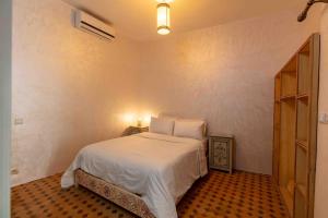 Postel nebo postele na pokoji v ubytování Riad Zinoun & Spa 11 Rooms