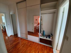 a large mirror in a room with a wooden floor at Apartments Laus in Dubrovnik +246 photos