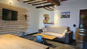 TV a/nebo společenská místnost v ubytování Gîte citadin de l'Entreville