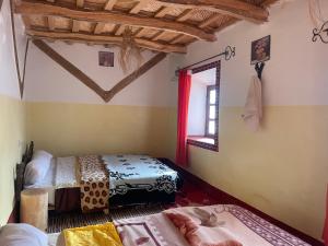 Postel nebo postele na pokoji v ubytování Dar Laayoune