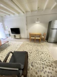 a living room with a couch and a table at Cozy townhouse near by Klong Dao beach in Ban Mo Nae