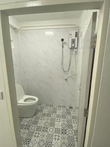 a bathroom with a toilet and a shower at Cozy townhouse near by Klong Dao beach in Ban Mo Nae +16 photos