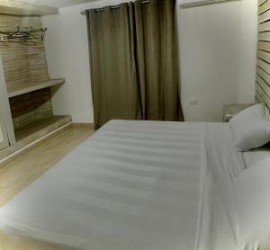 Postel nebo postele na pokoji v ubytování Buena Vista A5