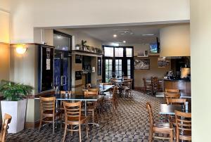 a dining room with tables and chairs in a restaurant at The Colliery Inn, Wallsend in Newcastle