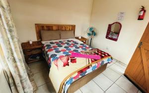 Ένα ή περισσότερα κρεβάτια σε δωμάτιο στο Malala Lodge
