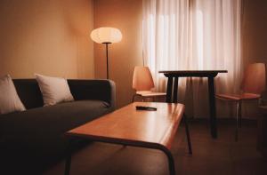 a living room with a couch and a table at Apartamentos entreRíos in Cazorla