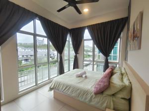 a bedroom with a bed and large windows at Cameron Golden Hills Near Night Market CH1 in Brinchang