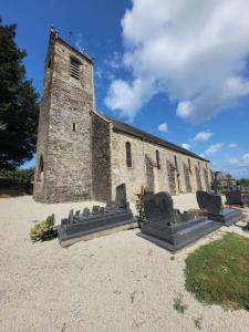 an old stone church with chairs in front of it at Château de la Rucquetière in Le Lorey +19 photos