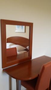 Posteľ alebo postele v izbe v ubytovaní Apartments and Rooms Astoria