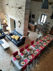 a long table with food on it in a living room at La Maison de Beaume in Créancey