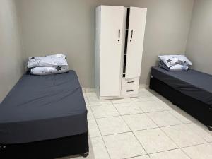 En eller flere senge i et værelse på Oakdale-Bellville Backpackers