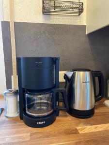 a coffee maker sitting on top of a counter at Traumhaftes Tiny Apartment in Weingarten +3 photos