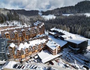 an aerial view of a resort in the snow at Apartments D242 & D243 in Aparthotel Vucko in Jahorina