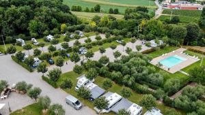 an aerial view of a parking lot with a pool at Seregnér Agricamping & Homes - Adults Only 18 in Monzambano