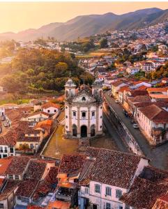 an aerial view of a town with mountains in the background at Casa Vintage in Ouro Preto
