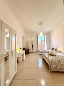 Posteľ alebo postele v izbe v ubytovaní Galasso Apartments